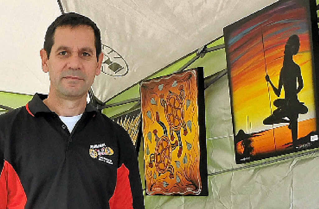 TRIBAL INSPIRATION: Rod McIntosh sells his original paintings at the NAIDOC family fun day.